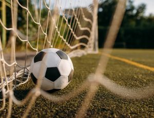 Soccer ball in the gate net, nobody